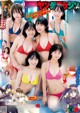 A group of women in bikinis posing for a magazine cover.